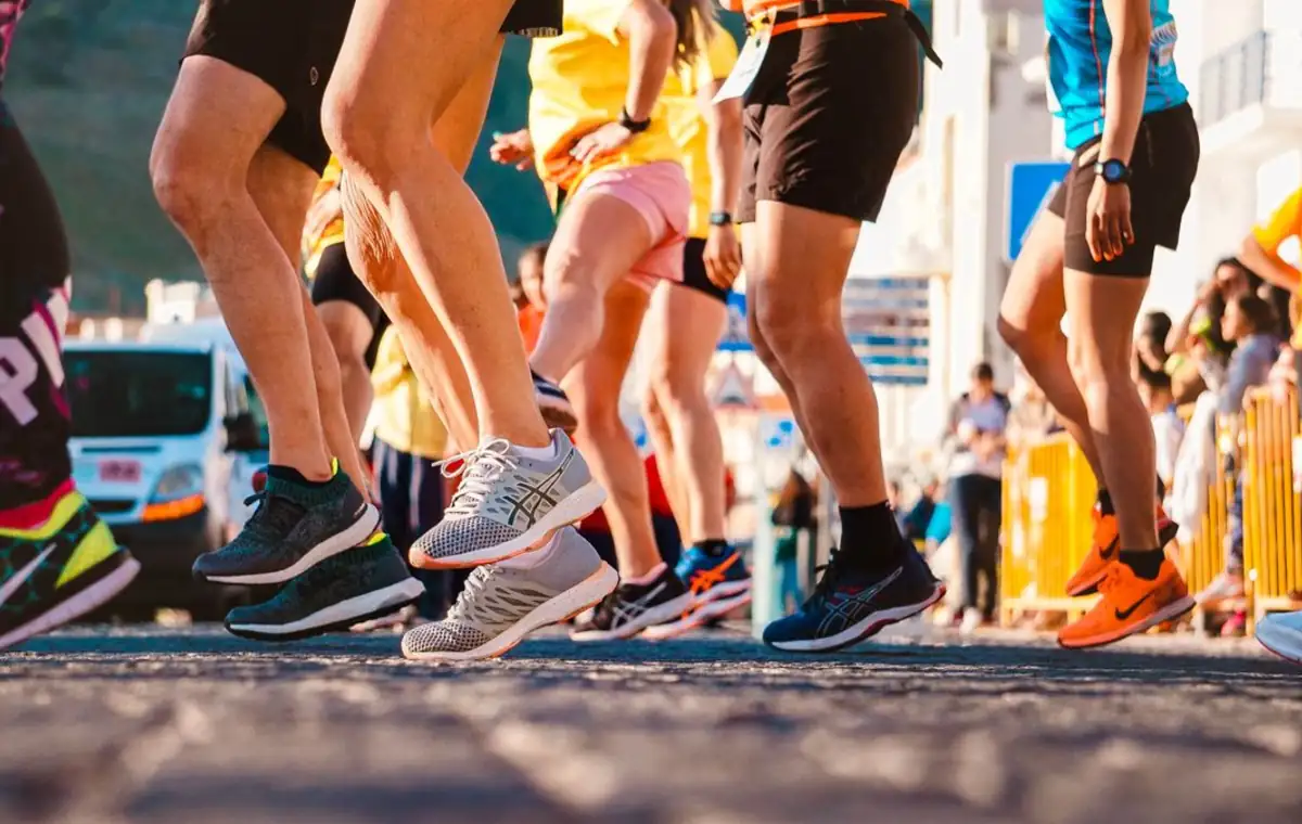 Runner tying shoes before a community race